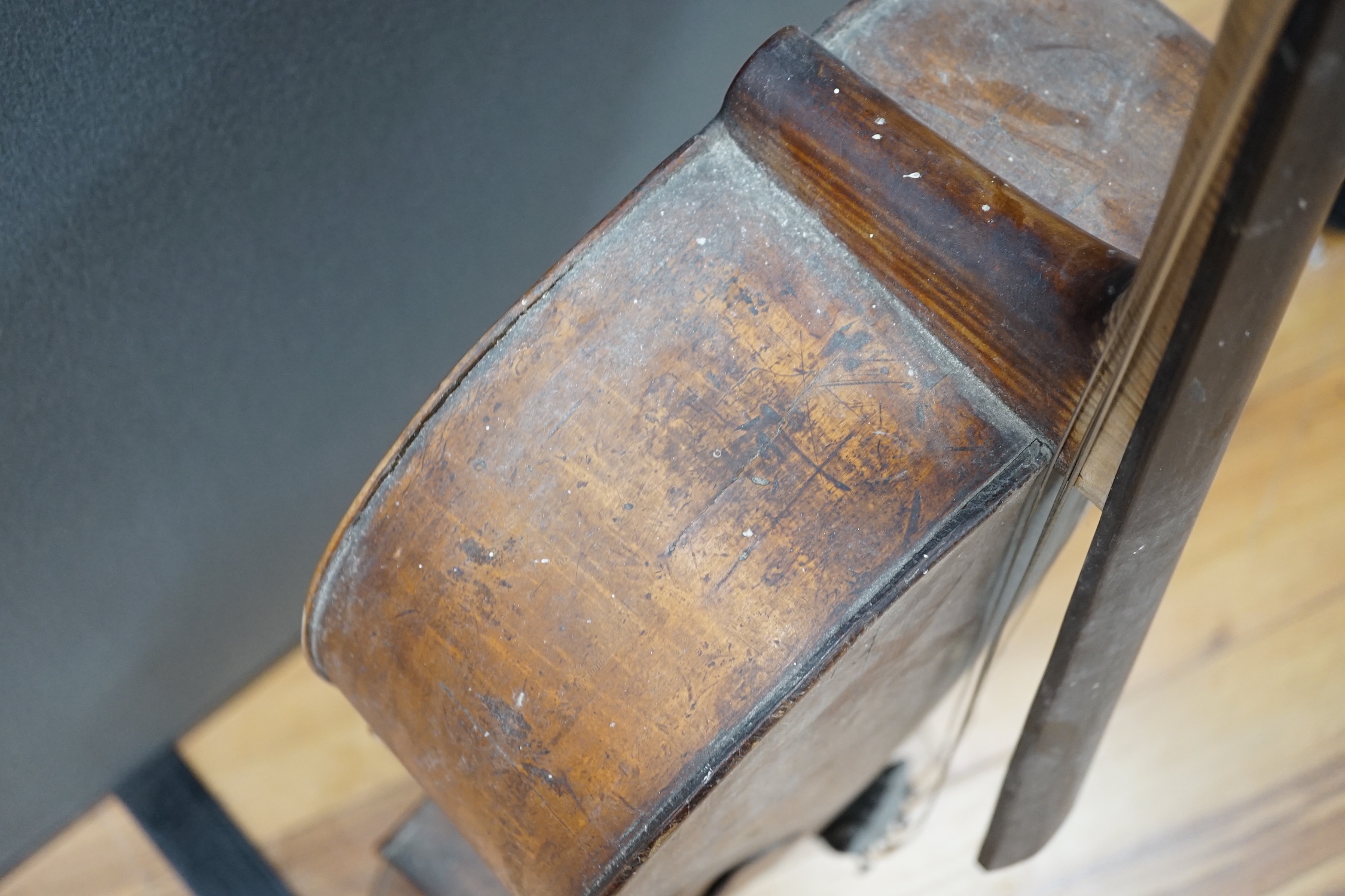 An early 20th century cello for restoration, indistinct internal label; ‘Restored by William J. Acton, Green Street, Forest Gate, London 1910’ length of body 72cm.